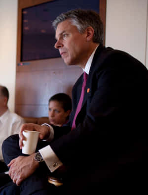 Jon Huntsman Holding Paper Cup Wallpaper