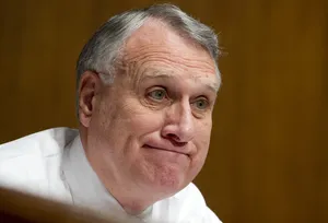 Jon Kyl Forced Smile Wallpaper