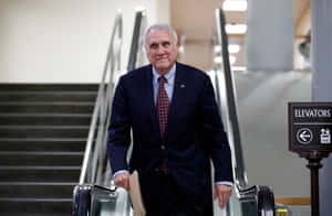 Jon Kyl On An Escalator Wallpaper