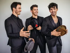 Jonas Brothers In Black Suits Wallpaper