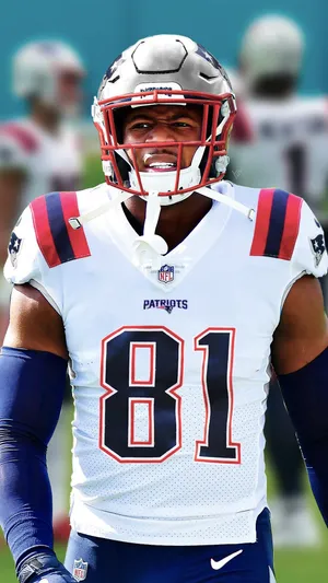 Jonnu Smith In Action During A Football Match Wallpaper