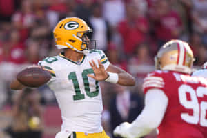 Jordan Love Green Bay Packers Quarterback Action Wallpaper