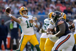 Jordan Love Quarterback Action Packersvs Bears Wallpaper