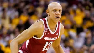 Jordan Walsh In Action During A Thrilling Basketball Match Wallpaper