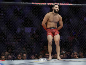 Jorge Masvidal Leaning On Cage Wallpaper