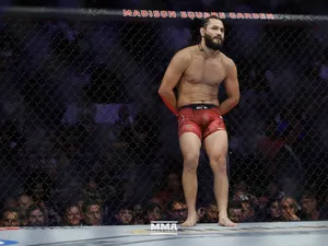 Jorge Masvidal Leaning On Cage Wallpaper