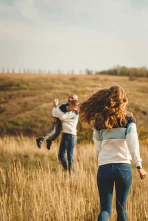 Joyful Family Outdoor Moment.jpg Wallpaper