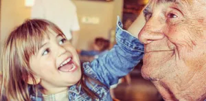 Joyful Grandchild With Grandparent Wallpaper