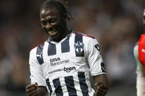 Joyful Soccer Player Celebration Wallpaper