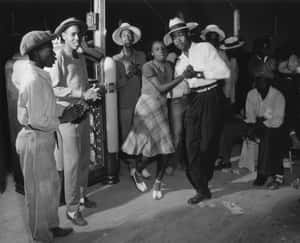 Jubilant Pair Practicing Swing Dance Wallpaper