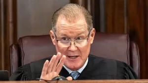 Judge Gesturing During Court Session Wallpaper