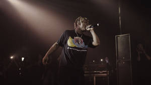 Juice Wrld Performing Live At A Concert Wallpaper