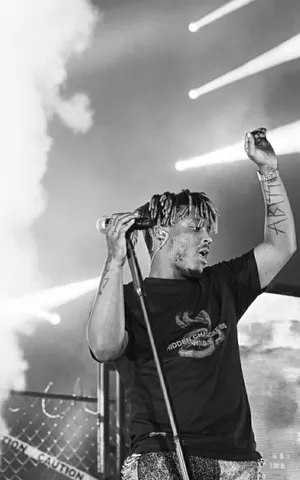 Juice Wrld Putting On A Spectacular Show For His Dedicated Fans Wallpaper