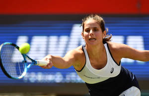 Julia Goerges Reaching Tennis Ball Wallpaper