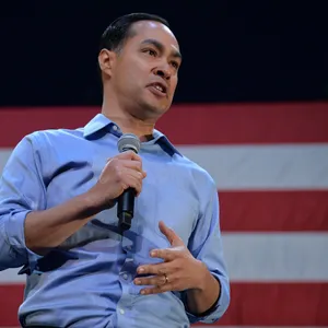 Julian Castro Holding A Microphone Wallpaper