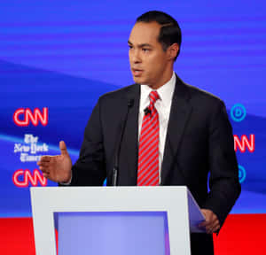 Julian Castro Speaking At A Podium Wallpaper