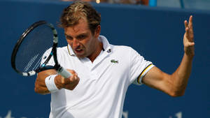 Julien Benneteau Pulling A Comical Expression On Court Wallpaper