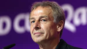 Jurgen Klinsmann Purple Background Wallpaper