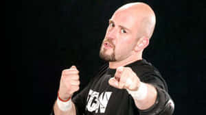 Justin Credible Expressively Pointing With Gesturing Hand Wallpaper