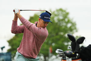 Justin Rose Swinging For A Golf Shot Wallpaper