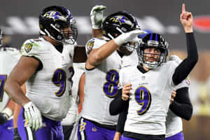 Justin Tucker Celebrationwith Teammates Wallpaper