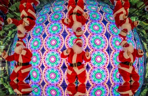 Kaleidoscopic Santa Claus Illusion Wallpaper