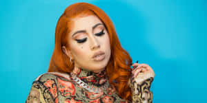 Kali Uchis Orange Hair Blue Backdrop Wallpaper