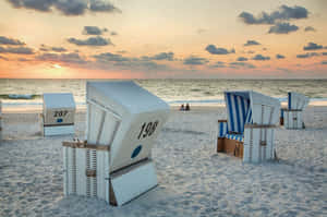 Kampen Beach Sunset With Strandkorb Chairs Wallpaper