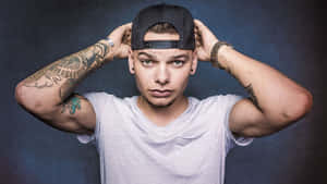 Kane Brown White Shirt And Cap Wallpaper