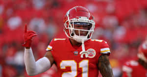 Kansas City Chiefs Player Gesturing On Field Wallpaper