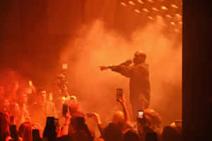 Kanye West Performancein Red Haze Wallpaper