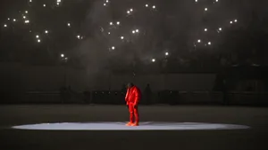 Kanye West Red Outfit Spotlight Performance Wallpaper
