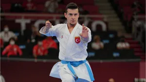 Karate Practitioners Wearing Traditional Martial Arts Uniforms Showcasing Their Power Wallpaper