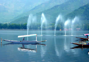 Kashmir Lake With Fountainsand Shikaras Wallpaper