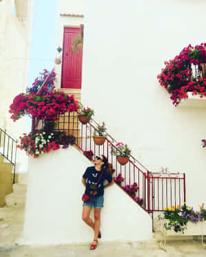 Kate Ritchie Striking A Pose In An Elegant Outfit Wallpaper