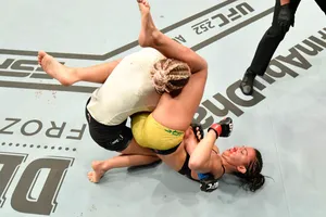Katlyn Chookagian Being Headlocked Wallpaper