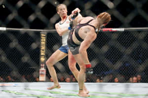 Katlyn Chookagian Masterfully Evading An Attack During A Match. Wallpaper