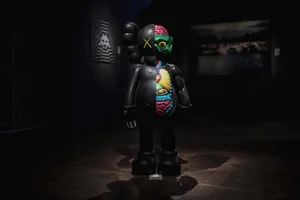 Kaws Bearbrick In Gallery Display Wallpaper