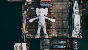 Kaws' Unique Inflatable Artwork On Display At Kaws:holiday Wallpaper