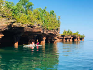 Kayaking Near Sea Caves Wallpaper