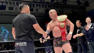 Kazuyuki Fujita Holding The Ghc National Championship Trophy Wallpaper