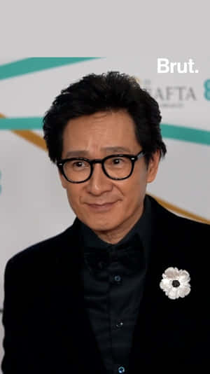 Ke Huy Quan Posing For A Portrait Wallpaper