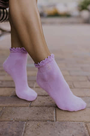 Keep Active And Stylish With These Cozy Purple Socks Wallpaper