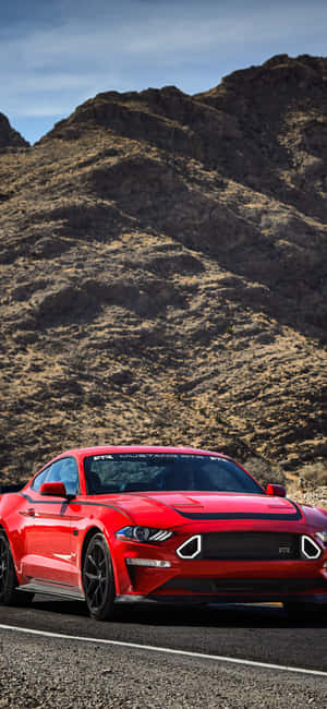 Keep Up With The Trends With The Sleek Design Of A Mustang Iphone Wallpaper