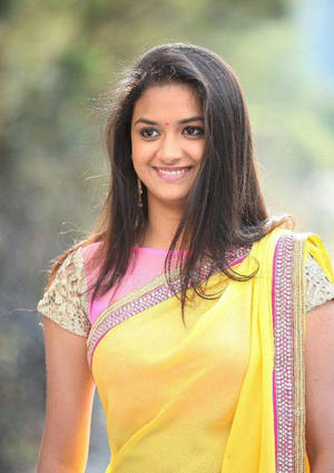 Keerthi Suresh Standing In Yellow Sari Hd Wallpaper