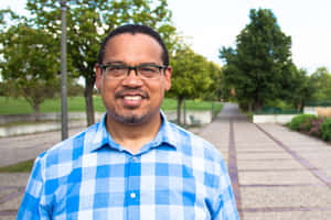 Keith Ellison In Blue Plaid Shirt Wallpaper