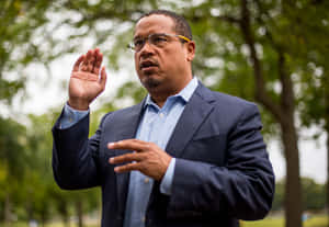 Keith Ellison Using Hand Gestures Wallpaper