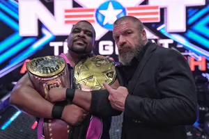 Keith Lee And Triple H Nxt Champion Belts Wallpaper