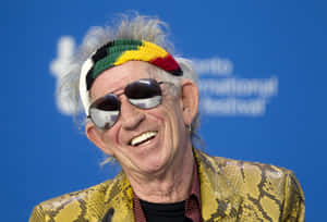 Keith Richards Laughingwith Sunglasses Wallpaper