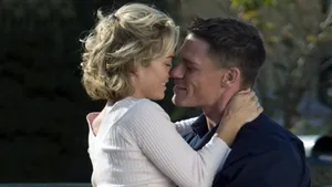 Kelly Carlson Posing In An Elegant Cream Dress Wallpaper